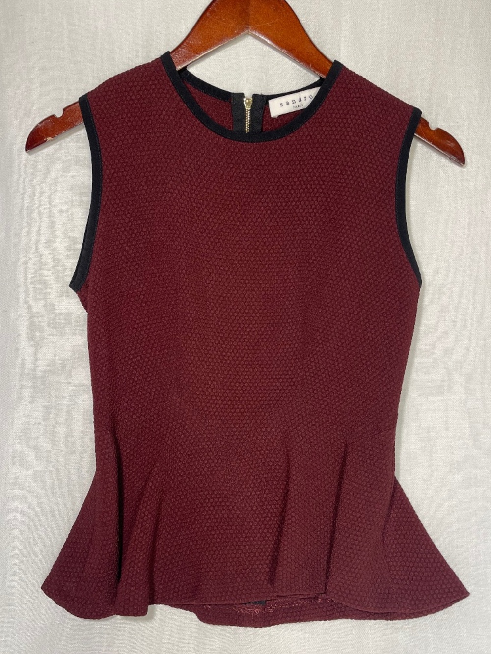 Sandro Sleeveless Peplum Top in Burgundy with Black Trim